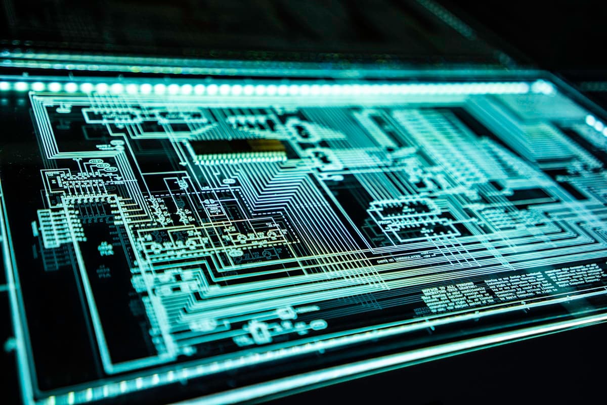 Glowing circuit schematic representing digital security systems