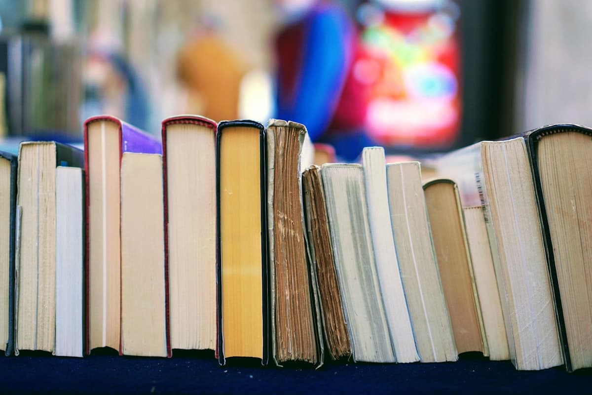Close-up of book pages lined on a shelf
